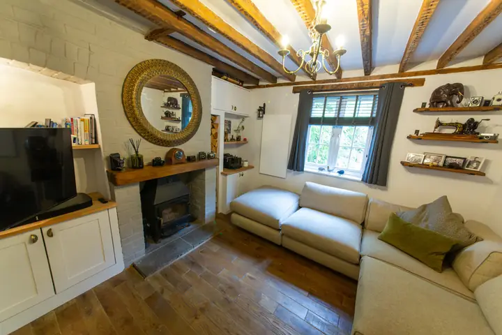 Living room, beamed ceiling and fireplace