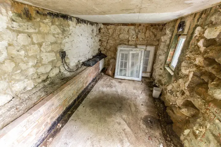 Stone-walled store beneath the raised terrace